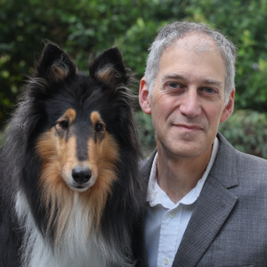 Cary Lieberman, Executive Director poses with his dog.